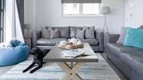 After a busy day, cuddle up on the sofa and catch a movie on the Smart TV.