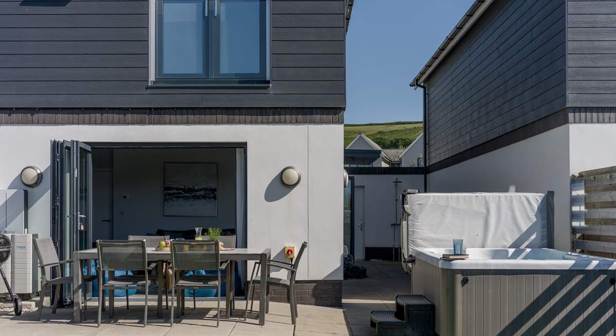 Relax in the hot tub after a busy day on the beach - additional charges apply.
