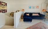 Upstairs, unwind on the beautiful sofa. - Thumbnail Image