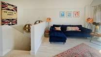 Upstairs, unwind on the beautiful sofa.