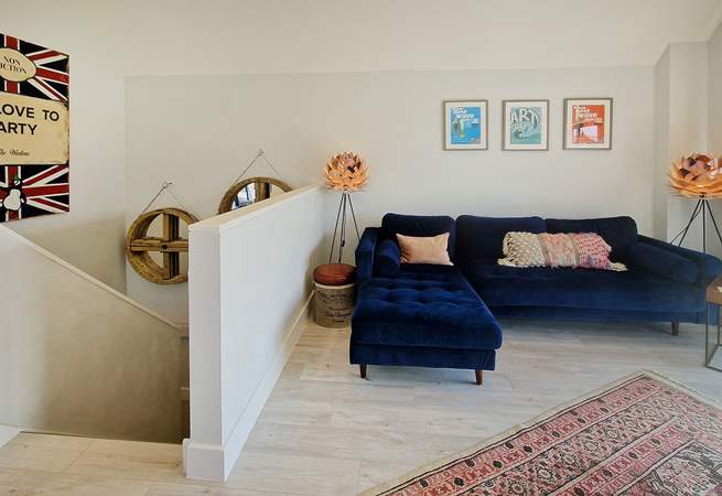 Upstairs, unwind on the beautiful sofa.