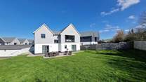 The large grassed lawn area is perfect for children and the family dog. 