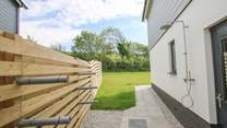 Here you'll find an outside shower, surf board storage and a wetsuit rail. 