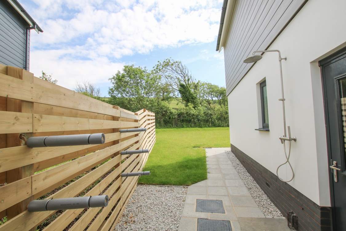 Here you'll find an outside shower, surf board storage and a wetsuit rail.