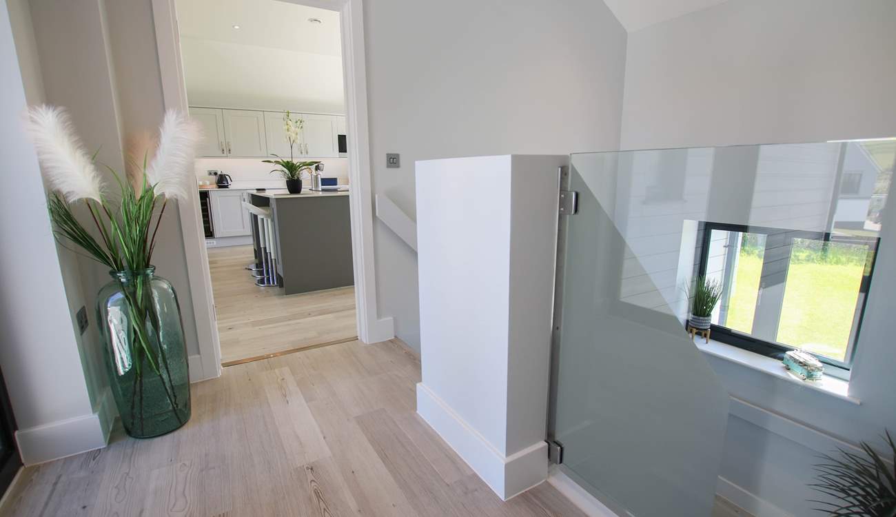 The stairs lead down to the ground floor bedrooms. 