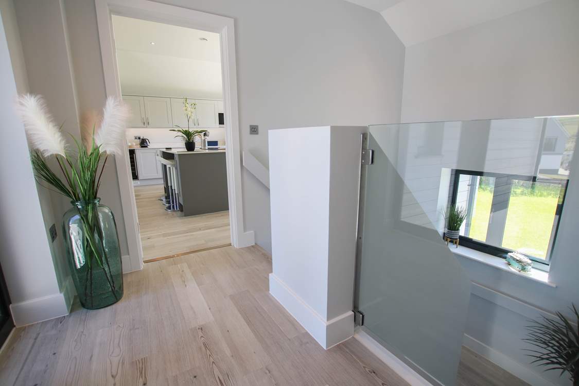 The stairs lead down to the ground floor bedrooms.
