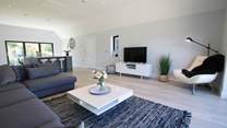 Contemporary furnishings in the open plan first floor living area. 