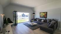 Bi-fold doors to the front let in the light. 