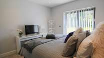 This bedroom has a TV.