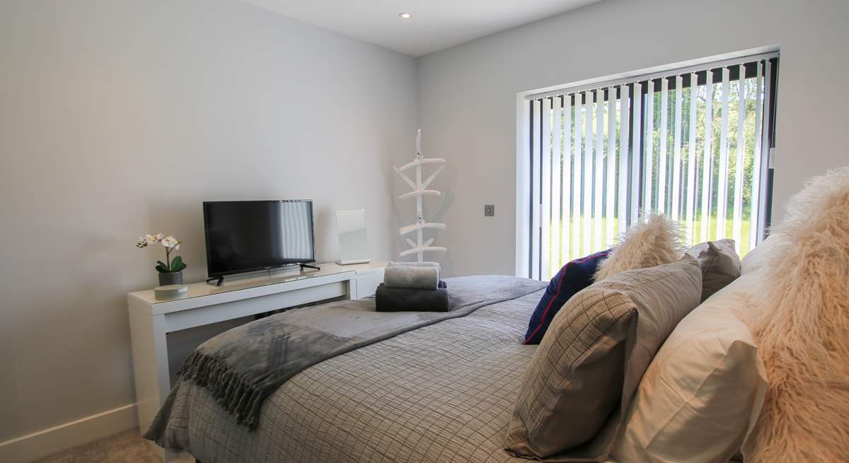 This bedroom has a TV.