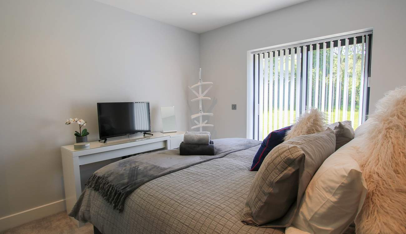 This bedroom has a TV.