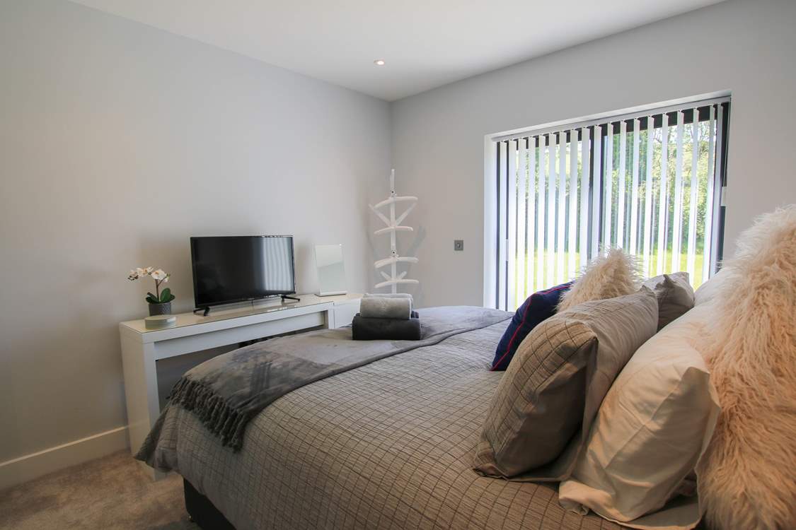 This bedroom has a TV.
