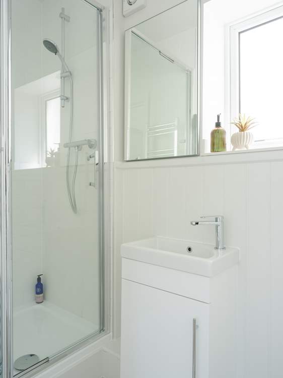 Bedroom 1 has an en suite shower-room, perfect for washing off those sandy toes.