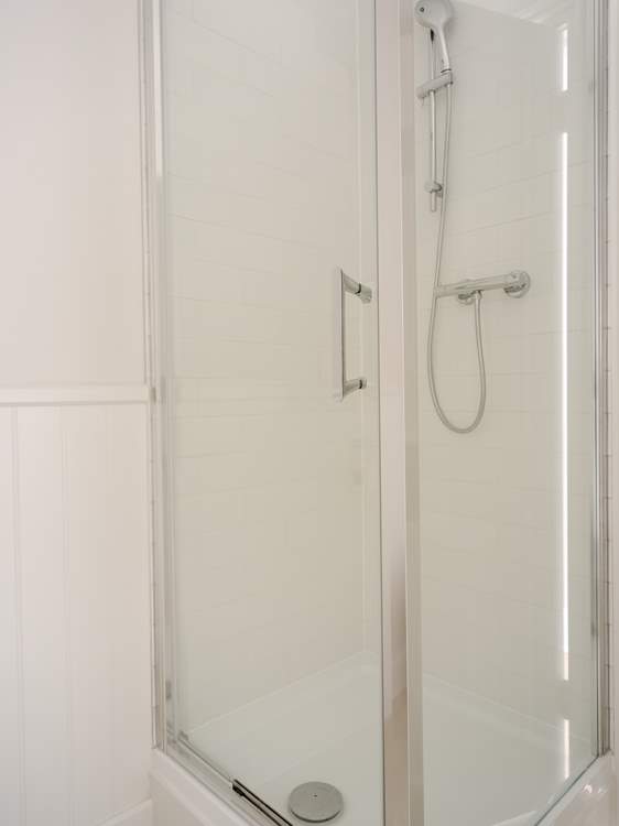 The shower cubicle in the family bathroom.