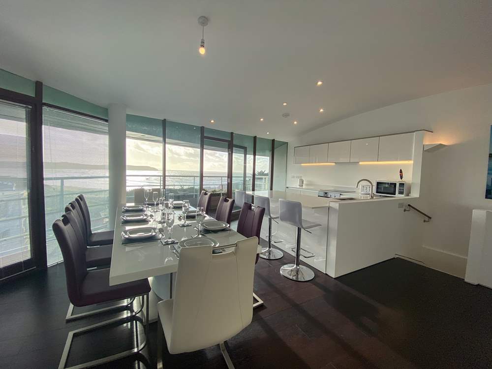 The elegant dining area and stylish kitchen.