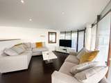 Cosy up on the sofa and catch a movie on the Smart TV.