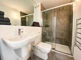 The family shower-room has a large shower cubicle.