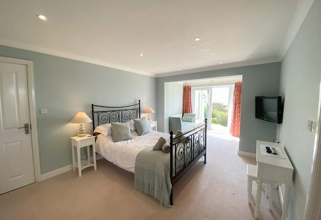 This gorgeous bedroom has access to the garden. 