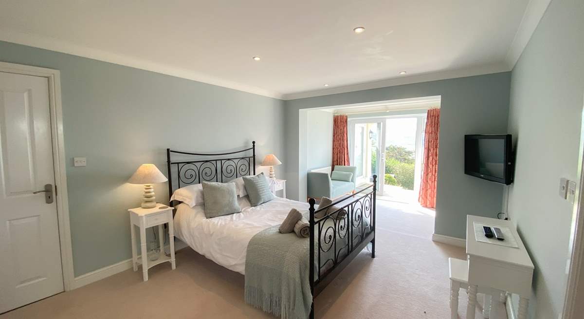 This gorgeous bedroom has access to the garden. 