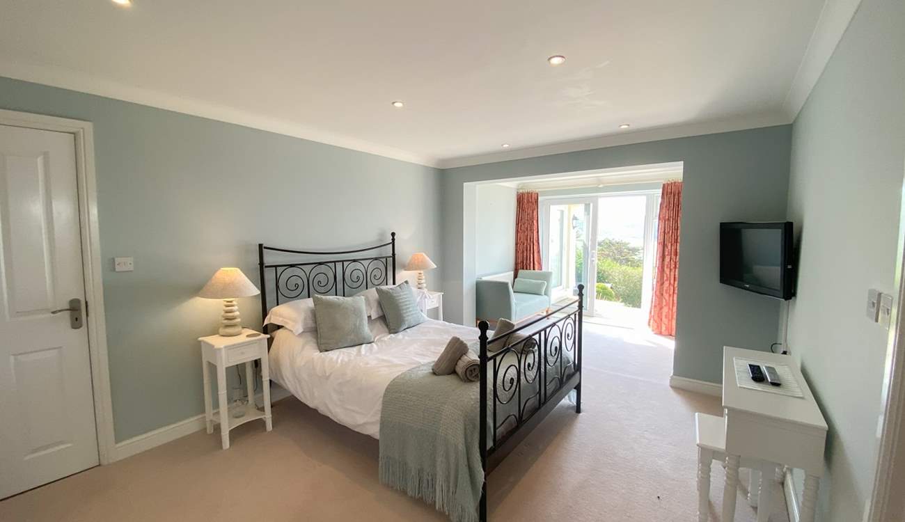 This gorgeous bedroom has access to the garden. 