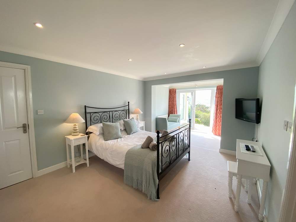 This gorgeous bedroom has access to the garden.