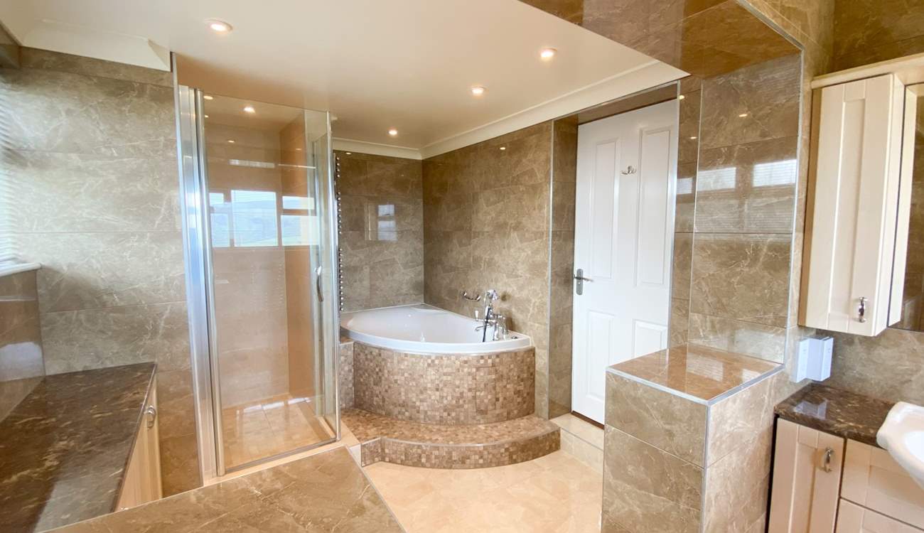 Soak in the corner bath or have a refreshing shower, you choose!