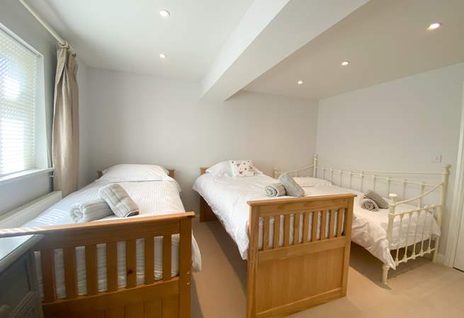 The twin bedroom has an additional day bed, suitable for children only. This room also has an en suite shower-room. 