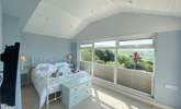 This pretty bedroom has delightful views.  - Thumbnail Image
