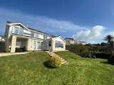 Enjoy the back garden with views out across the coast.