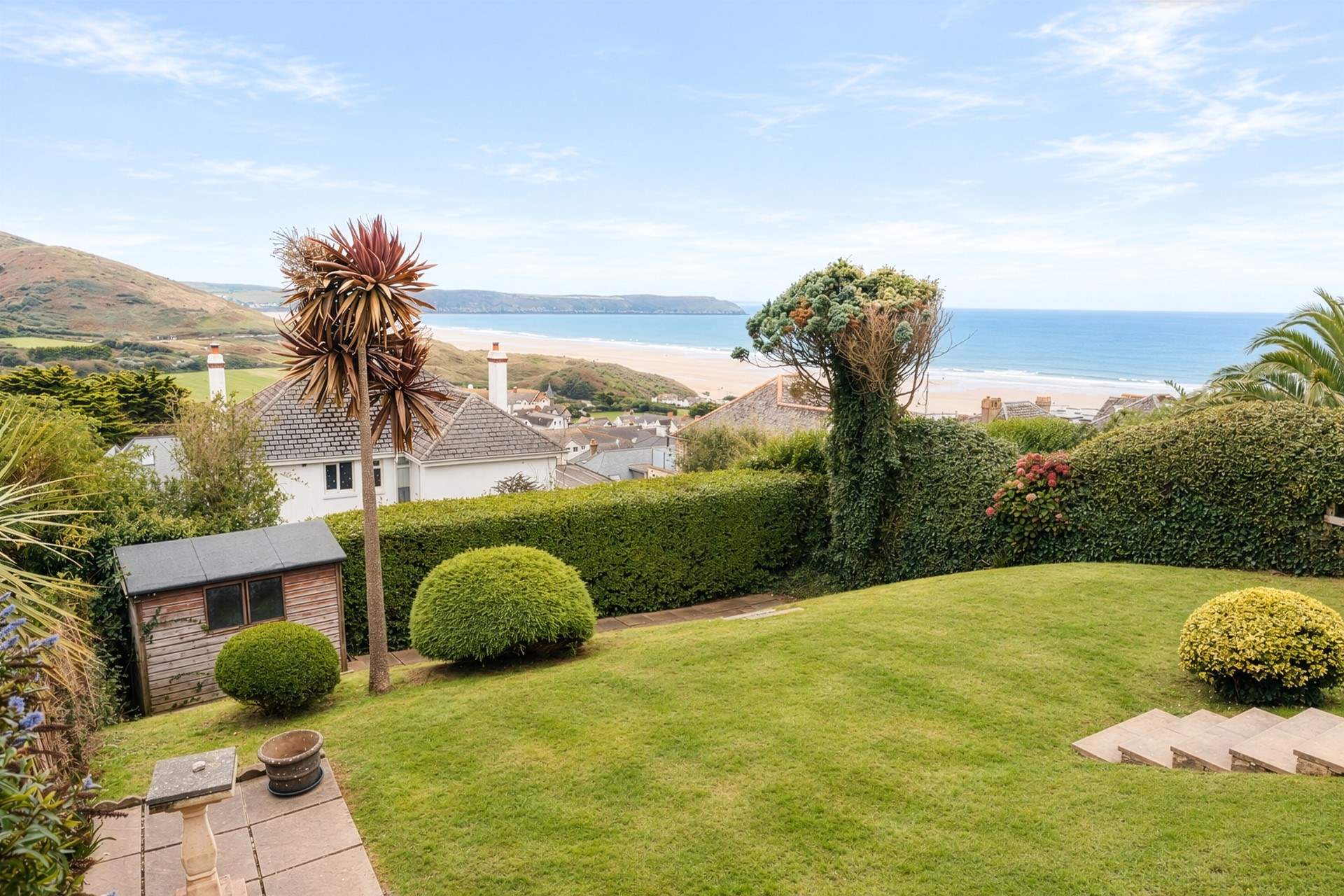 Enjoy the back garden with views out across the coast.