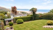 Enjoy the back garden with views out across the coast.