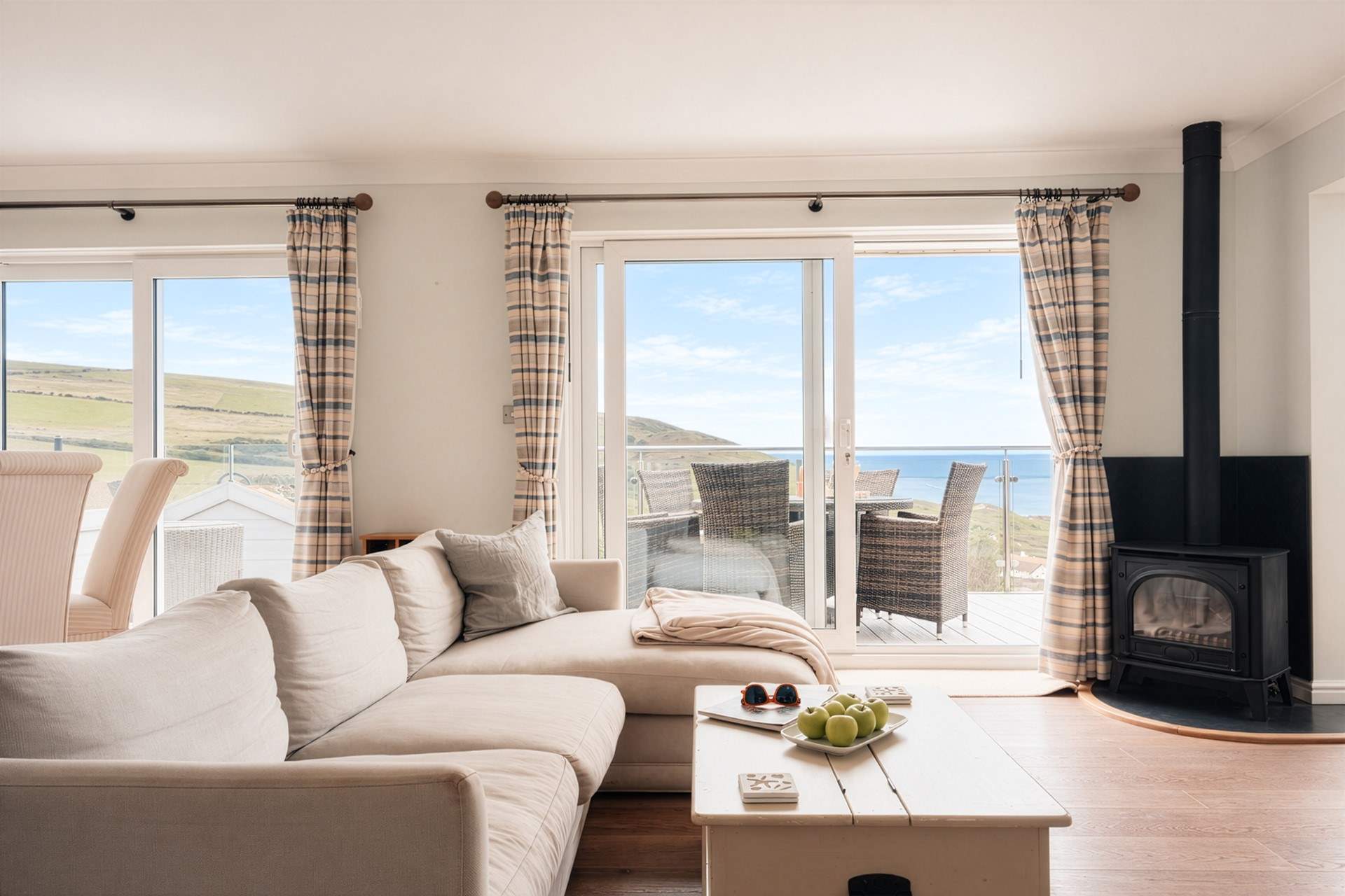 The living area is found on the first floor to make the most of the wonderful views. There's a wood-burner effect gas stove to keep you warm on cooler days. This is currently awaiting repair.