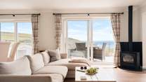 The living area is found on the first floor to make the most of the wonderful views. There's a wood-burner effect gas stove to keep you warm on cooler days. This is currently awaiting repair.