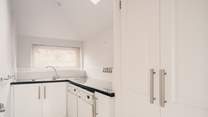 There's even a handy utility-room housing a washing machine and tumble-drier.