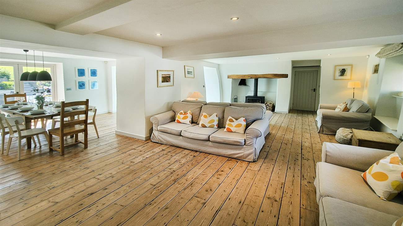 The gorgeous sitting-room has a warming wood-burner.