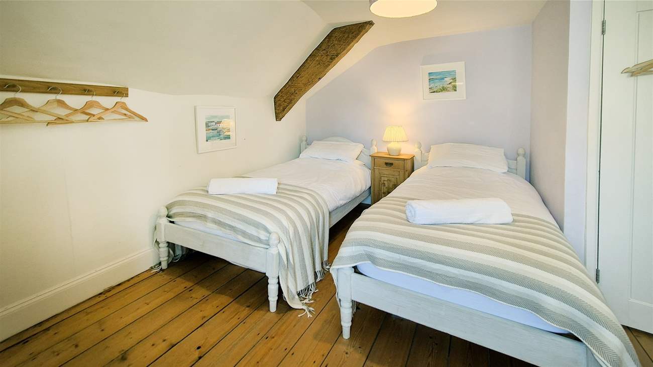 This sweet twin bedroom is ideal for either adults or children.