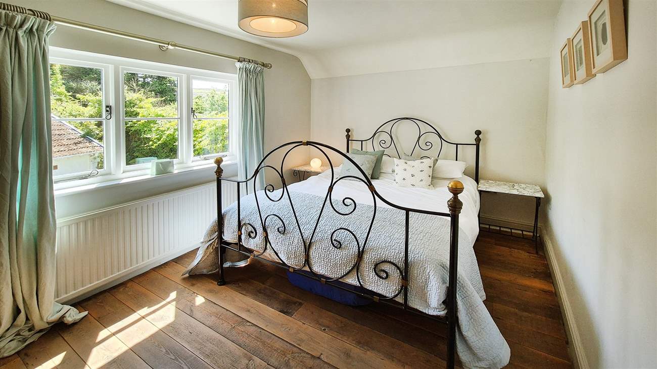 The beds are adorned with beautiful bed linens.