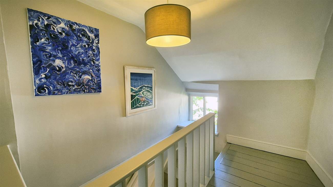 Stairs lead to the bedrooms on the first floor.