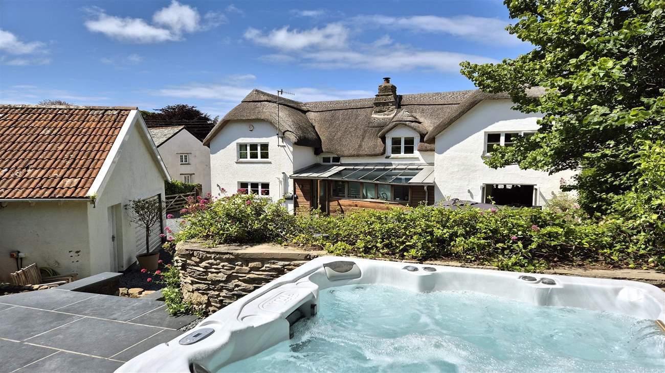 The hot tub is perfect for relaxing after a day on the beach. Additional charges apply.