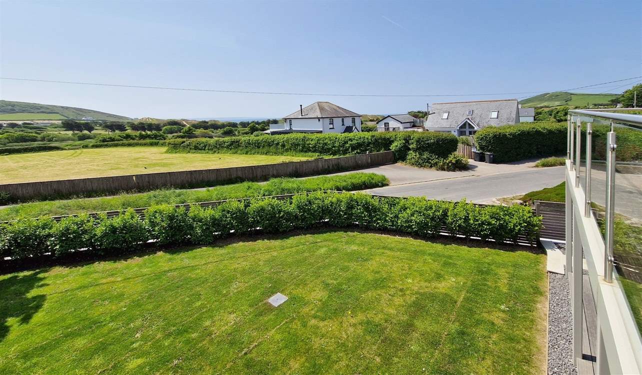 The view towards the sea from the balcony takes in the sand dunes and countryside.