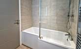 The en suite bathroom, perfect for a long soak after a busy beach day.  - Thumbnail Image