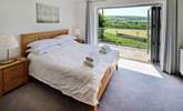 Lovely linens adorn the beds.  - Thumbnail Image
