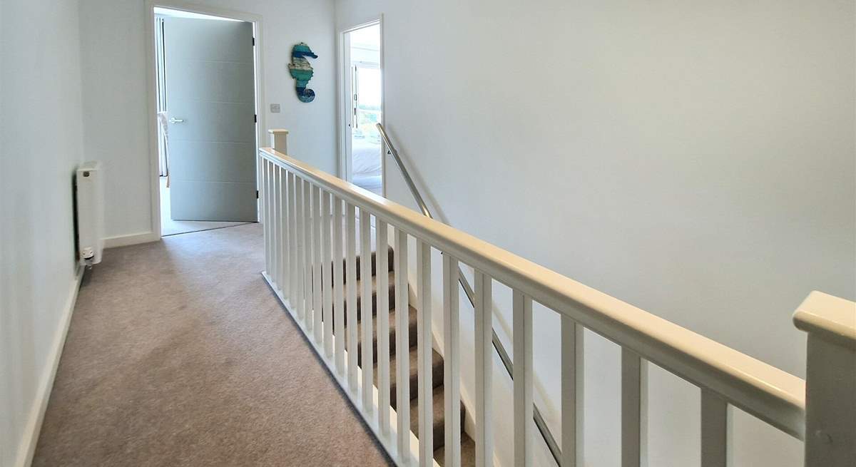 Three bedrooms are located on the first floor. 