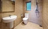 The wet-room is on the ground floor and ideal for rinsing salty toes after a beach day.  - Thumbnail Image