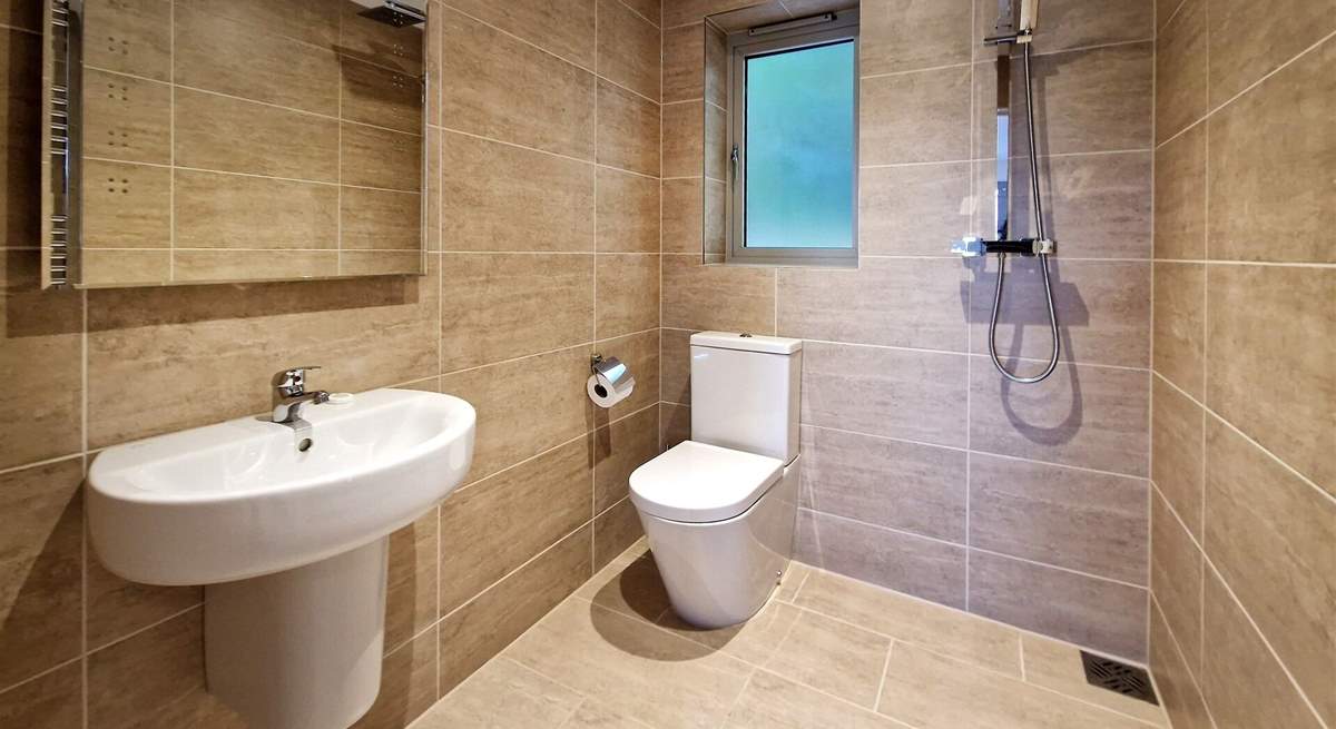 The wet-room is on the ground floor and ideal for rinsing salty toes after a beach day. 