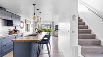 Head upstairs to find three of the four bedrooms with the bunk bed room being to the right of the stairs.