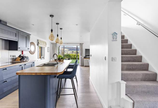 Head upstairs to find three of the four bedrooms with the bunk bed room being to the right of the stairs.