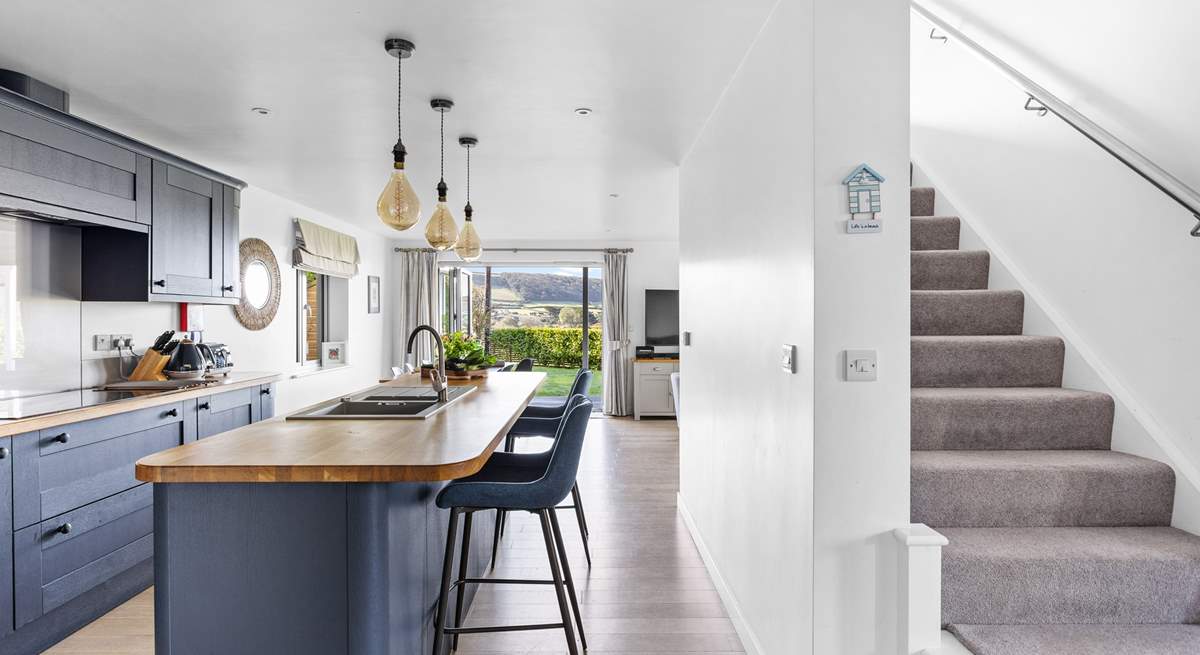 Head upstairs to find three of the four bedrooms with the bunk bed room being to the right of the stairs.