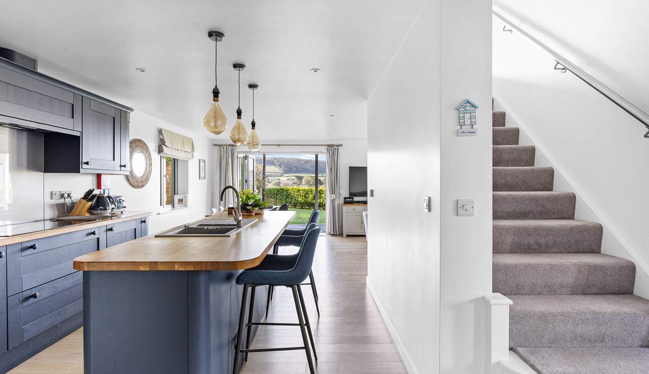 Head upstairs to find three of the four bedrooms with the bunk bed room being to the right of the stairs.