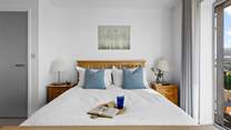 Both double bedrooms have king-size beds an en suite bathroom with a shared balcony.